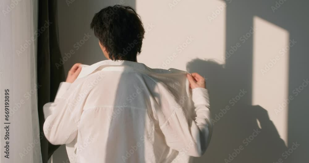 young man putting on shirt, student preparing to go to college slow motion, guy going to work, daily routine Back rare view sexuality, male gets ready for work young man putting on shirt, student preparing to go to college slow motion, guy going to work, daily routine Back rare view sexuality, male gets ready for work