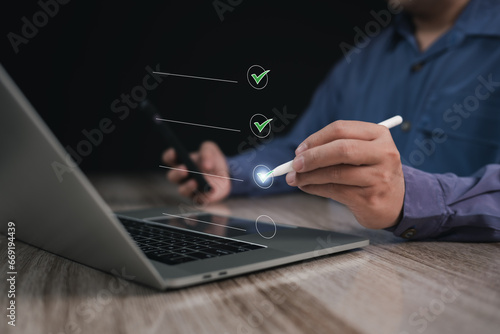 Digital Business Survey Checklist : Businessman using Stylus pen with laptop Evaluating Assessments Online , Surveys and Assessments , Maximizing Efficiency or Streamlining Success in the Digital Age 