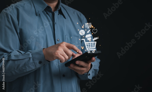 Concept technology online shopping or e-commerce : Businessman touching or pressing the virtual screen of an online store in order to order what he wants in website and offers home delivery.	