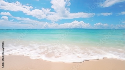 Beautiful natural tropical summer beach background with golden sand  turquoise ocean  and blue sky with white clouds