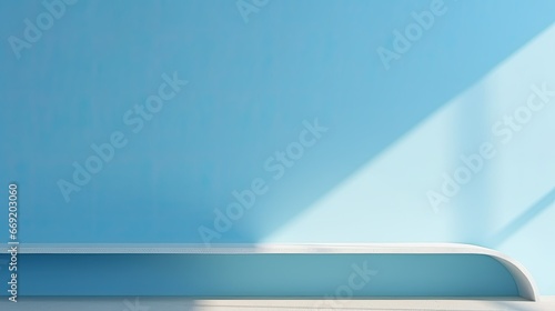 Blurred shadows on a pastel blue wall, sunlight through a window, white wooden floor, blank space for presentation