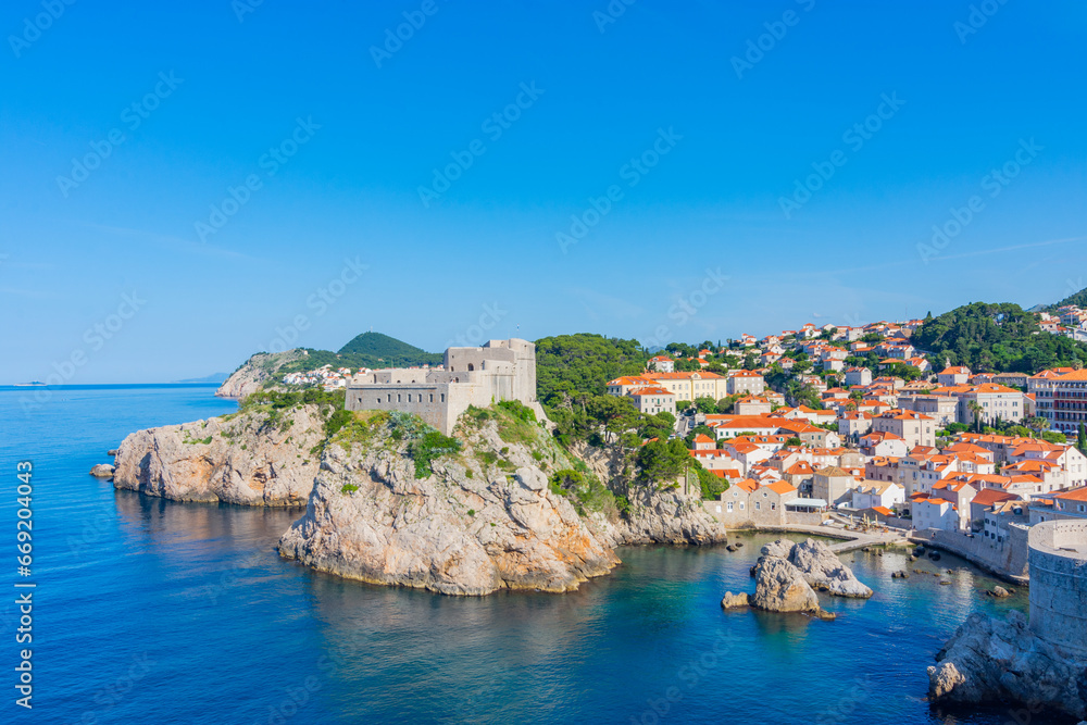 View of Fort Lovrijenac or St. Lawrence Fortress from Dubrovnik city wall. Fort Lovrijenac fortress,. Dubrovnik is a historic city in Croatia region of Dalmatia. UNESCO World Heritage Site - obrazy, fototapety, plakaty 