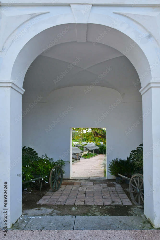 Fototapeta premium Entrance to the garden inside the park around the 18th century Bourbon palace in Naples, Italy.
