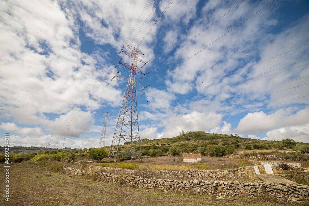 Power lines and tower, sunny day Power lines and tower, sunny day