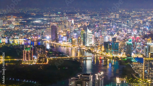 Aerial view of Ho Chi Minh City skyline and skyscrapers on Saigon river, center of heart business at downtown, cityscape in the night © CravenA