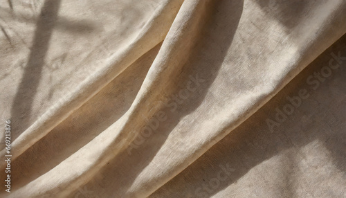 aesthetic neutral beige linen texture background with soft abstract sunlight shadows and folds