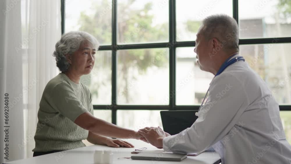 Doctor is advised treatment methods and recovery then touching patient hands for encouragement and support to old woman patient. Doctor is advised treatment methods and recovery then touching patient hands for encouragement and support to old woman patient.
