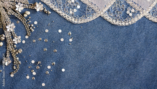 abstract blue denim background with silver sequins and lace photo
