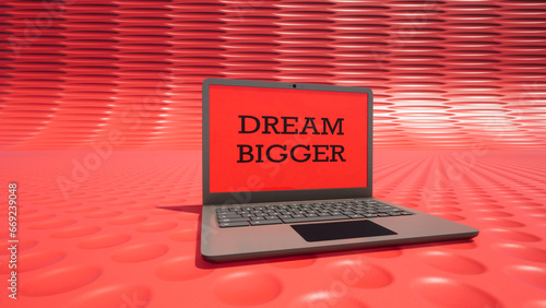 Modellazione 3D di computer portatile con testo DREAM BIGGER photo