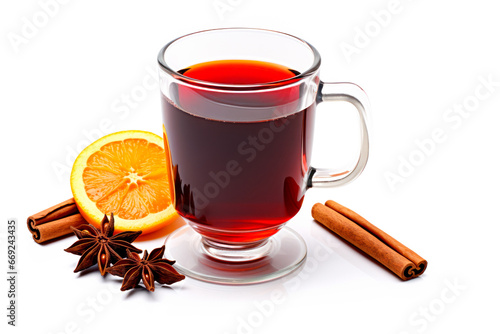 Christmas red mulled wine in cup with cinnamon sticks, orange slices and winter decorations isolated on white background
