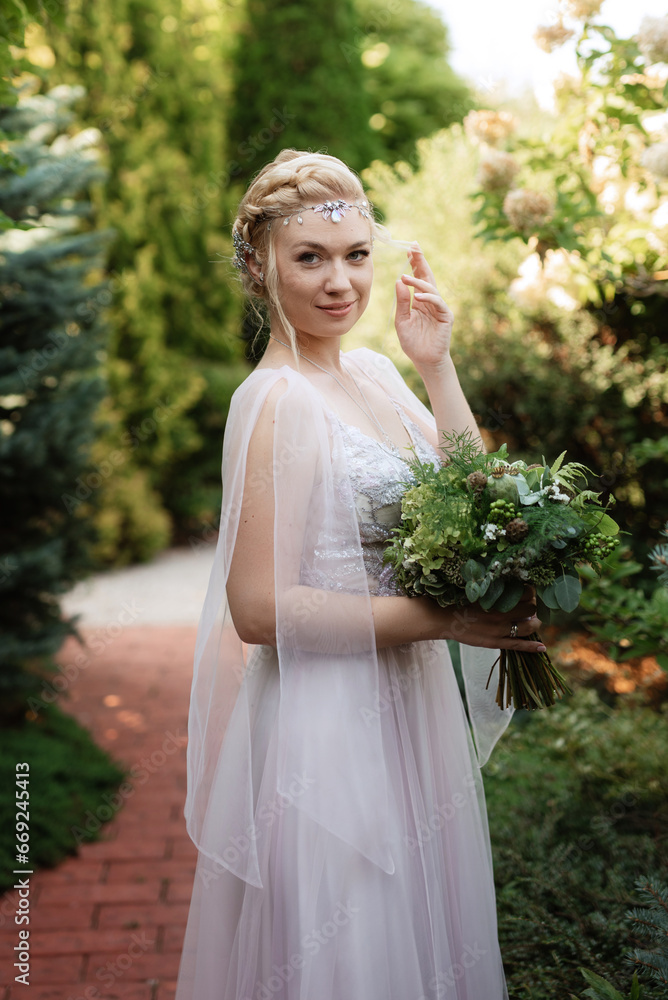 portrait of a happy bride in a light light dress in  wearing elven accessories