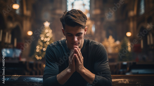 Male praying inside of christian church, concept of religion faith and christianity photo