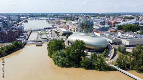 Aerial view of the Cité du Vin, the Wine Museum of Bordeaux in France - Modern discovery center dedicated to oenology and viticulture built with glass and metal on the banks of the river Garonne photo