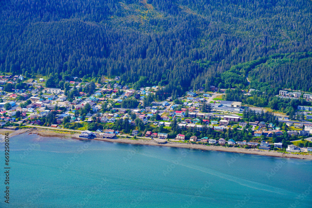 Aerial view of Douglas, an oceanfront residential neighborhood facing Juneau, the capital city of Alaska, USA - Real estate development along the coast of a fjord in the American arctic