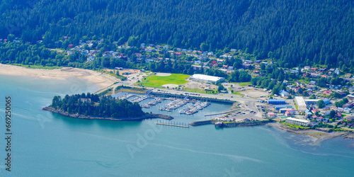 Aerial view of the marina of Douglas, an oceanfront residential neighborhood facing Juneau, the capital city of Alaska, USA - Mayflower island in the Gastineau Channel next to Savikko Park photo