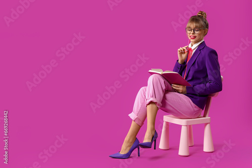 Young woman with notebook s...