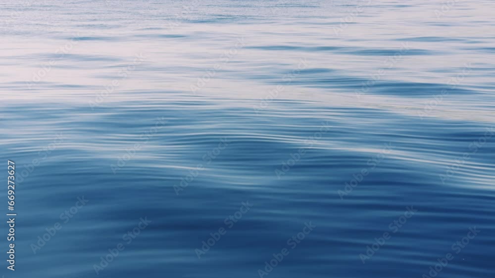Sea ocean sunset nature background. Small waves on water surface in motion blur Sea ocean sunset nature background. Small waves on water surface in motion blur