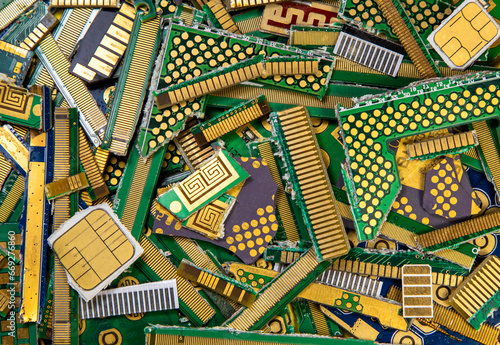 Recycling gold from electronic components. Gold waste from electronic, industrial boards photo