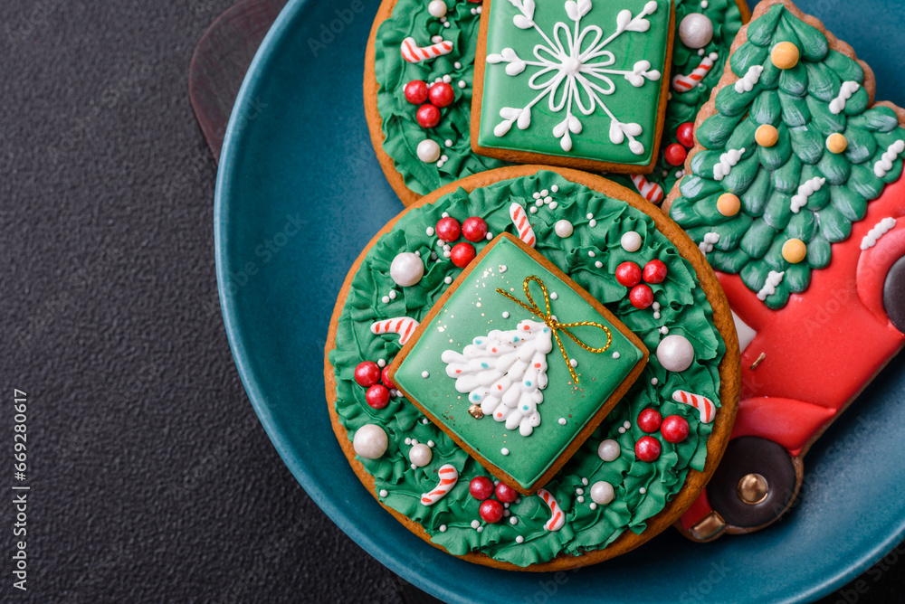 Beautiful Christmas gingerbread cookies on a round ceramic plate