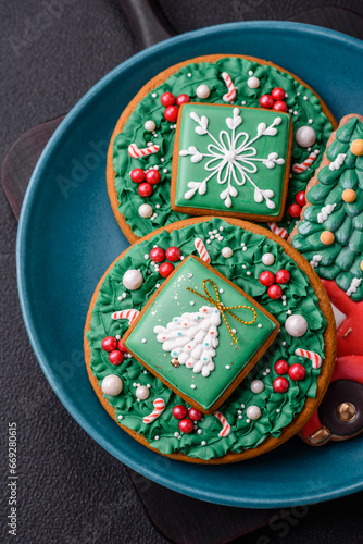 Beautiful Christmas gingerbread cookies on a round ceramic plate