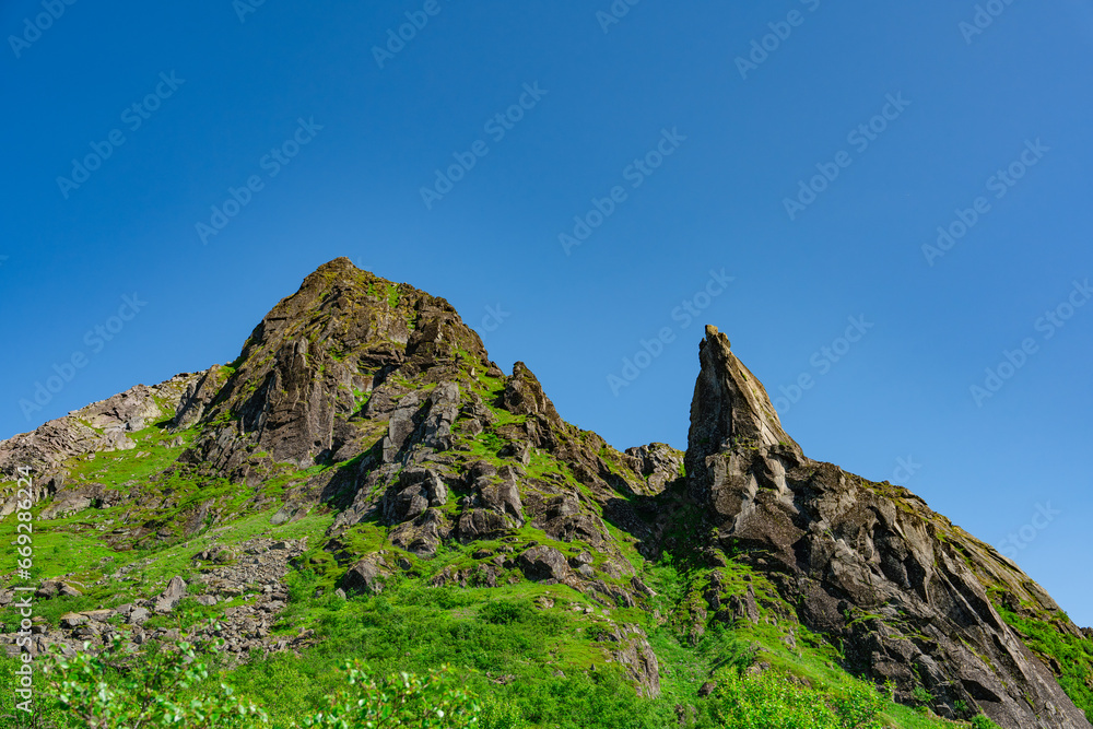 Djevelporten or Devils gate in Floya mountain hiking trail. Svolvaer trekking trail in Lofoten island, Scandinavia, Norway, activity famous places Djevelporten or Devils gate in Floya mountain hiking trail. Svolvaer trekking trail in Lofoten island, Scandinavia, Norway, activity famous places