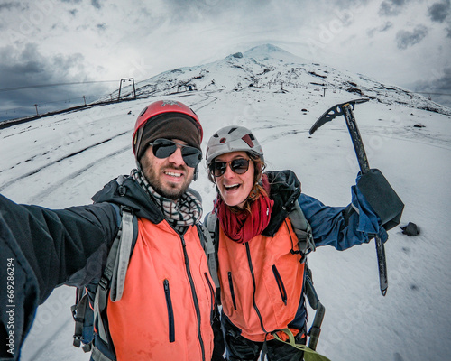 selfie de casal após fazer a caminhada até o cume do vulcão Villarrica, em Pucón, Chile  photo