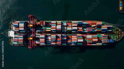 Aerial side view of cargo ship carrying containers from custom depot. Concept of freight shipping by ship service