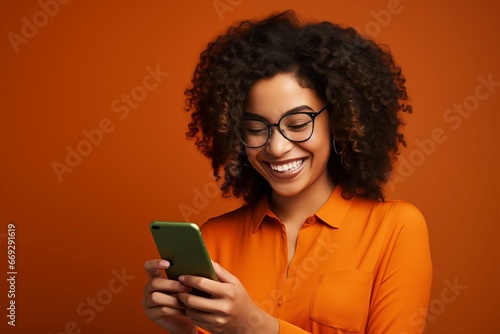 Elegant Woman Laughing While Checking Phone
