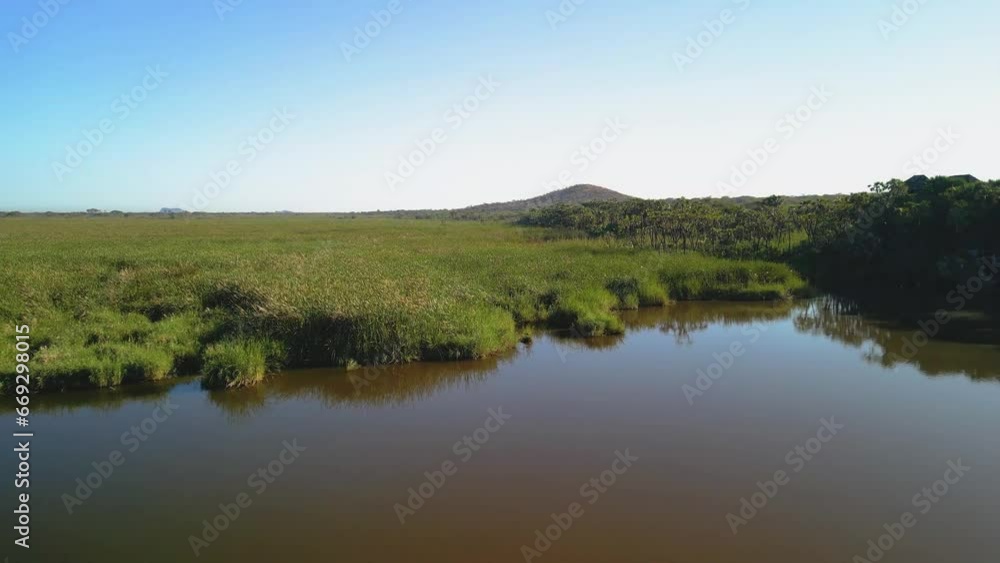 Awash National Park, Afar Province, Ethiopia. Aerial view of lake and Fentale mountains at sunset. Cinematic drone footage. No people. Awash National Park, Afar Province, Ethiopia. Aerial view of lake and Fentale mountains at sunset. Cinematic drone footage. No people.