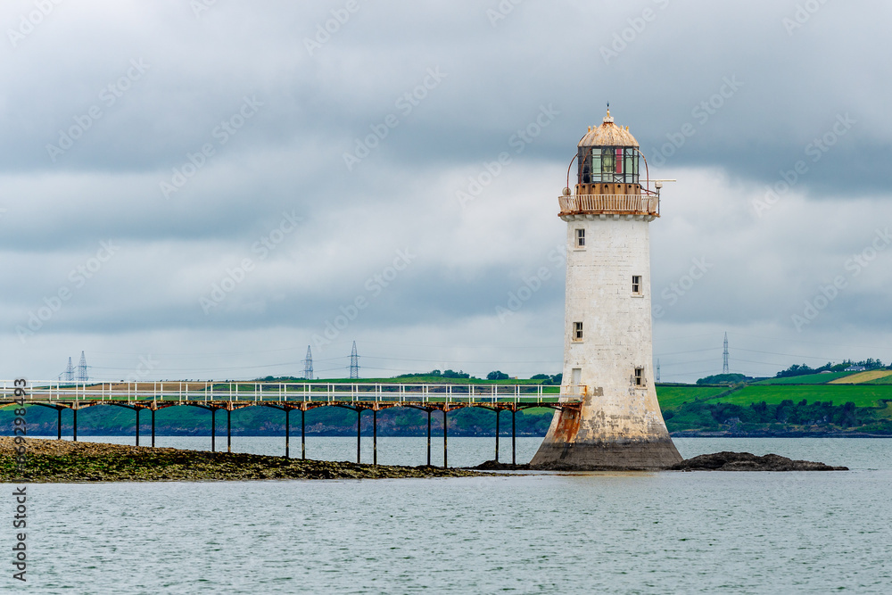 Tarbert Lighthouse on the coast of the sea
