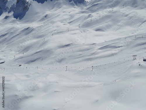 Ski resort on a clear Sunny day. Snow on the Zugspitze mountain height -2962 m. in Bavaria  Germany