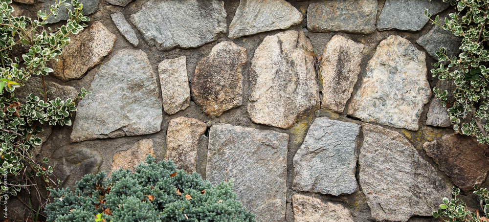 textured stone wall, a symbol of strength and resilience, with natural light casting captivating shadows textured stone wall, a symbol of strength and resilience, with natural light casting captivating shadows