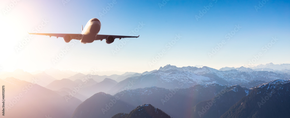 Naklejka premium Commercial Air Jet flying over the Canadian Mountain Landscape. 3d Rendering Airplane.