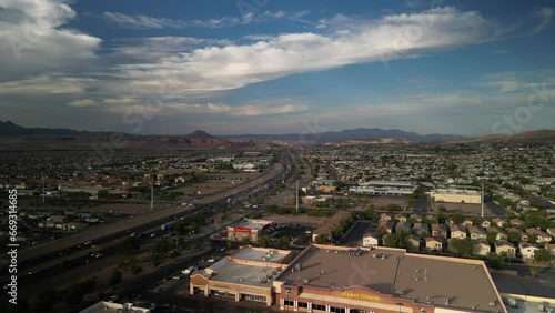 Aerial above highway and shopping center in Henderson Nevada
