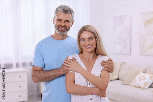 Portrait of happy affectionate couple at home. Romantic date