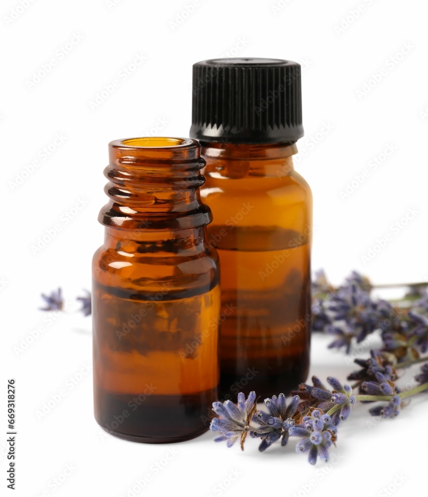 Essential oil and lavender flowers on white background Essential oil and lavender flowers on white background
