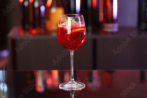 Glass of delicious refreshing sangria on counter in bar