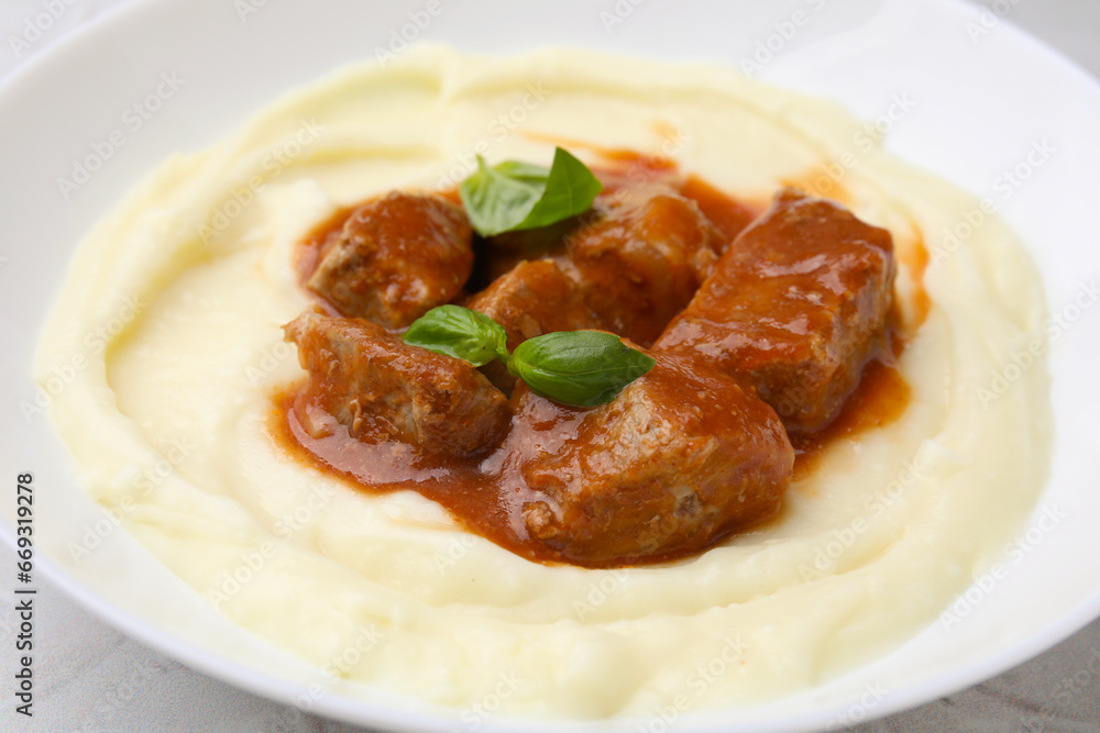 Delicious goulash with mashed potato on table, closeup Delicious goulash with mashed potato on table, closeup