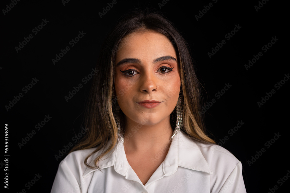 Studio portrait of a beautiful Caucasian woman with blonde hair wearing a white blouse and black shorts. Studio portrait of a beautiful Caucasian woman with blonde hair wearing a white blouse and black shorts.