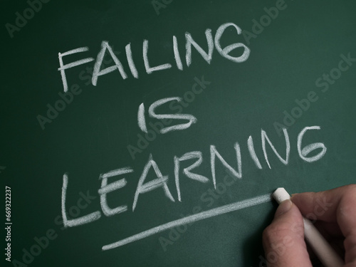 Failing is learning, text words typography written on chalkboard, life and busines