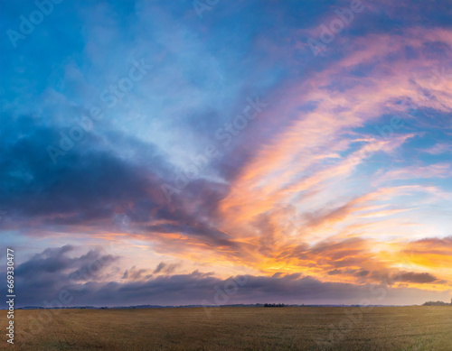 Beautiful panoramic sky with glowing clouds at sunset