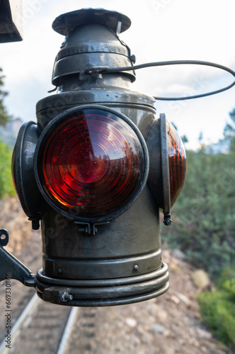 Fotografie Old, kerosene fired, authentic train lamp, in use, on the caboose of a steam pow