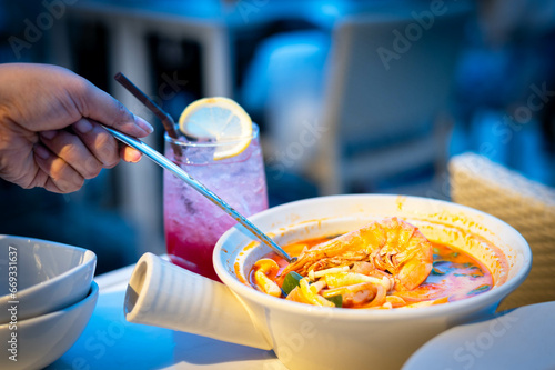 Tom Yam Kung , Sour prawn soup with mushrooms, Thai street food.