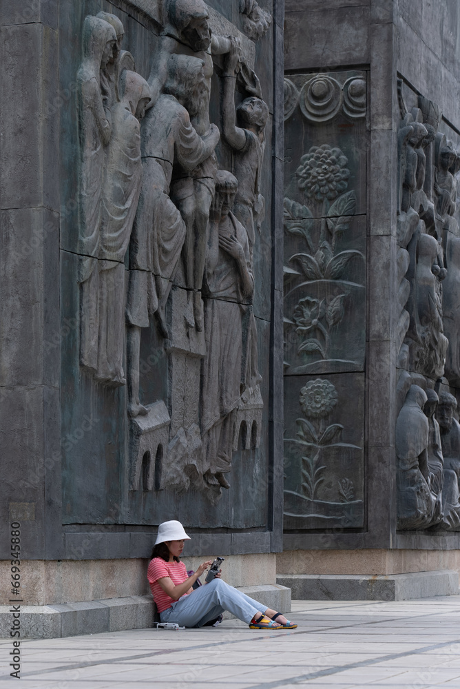 Asian Woman Preparing for Flying Drone in Chonicle of Georgia