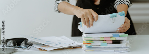 business documents businessman check legal document review Prepare documents or analysis reports, tax items, accounting documents, data contracts, office partner agreements.
