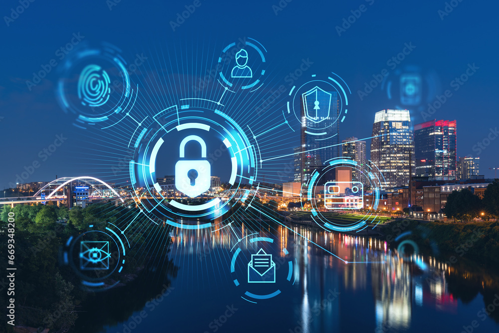 Panoramic view of Broadway district of Nashville over Cumberland River at illuminated night skyline, Tennessee, USA. Padlock hologram. The concept of cyber security to protect confidential information Panoramic view of Broadway district of Nashville over Cumberland River at illuminated night skyline, Tennessee, USA. Padlock hologram. The concept of cyber security to protect confidential information