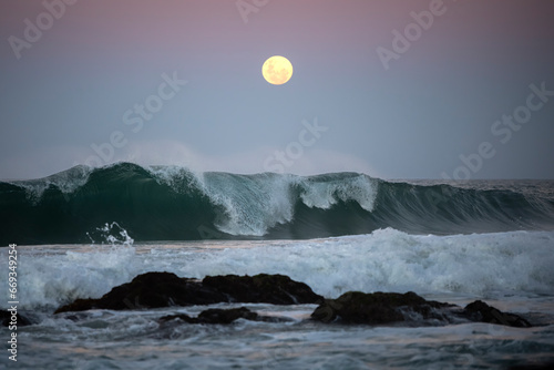Canvas Print Supermoon rising over the ocean, Australia.