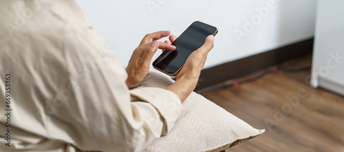 Middle age Asian woman holding cell telephone. senior woman with