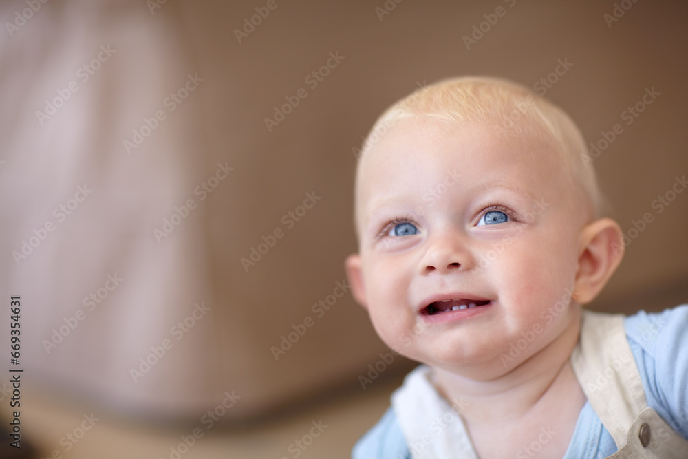 Baby, face and look up curious thinking for explore home, safety or parent. Boy, son and comfort relax for healthy childhood development or love living room or playful, growth support or calm care