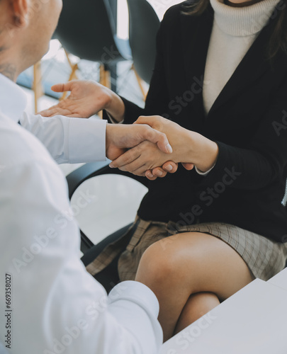 .Business handshake for teamwork of business merger and acquisition,successful negotiate,hand shake,two businessman shake hand with partner to celebration partnership and business deal concept